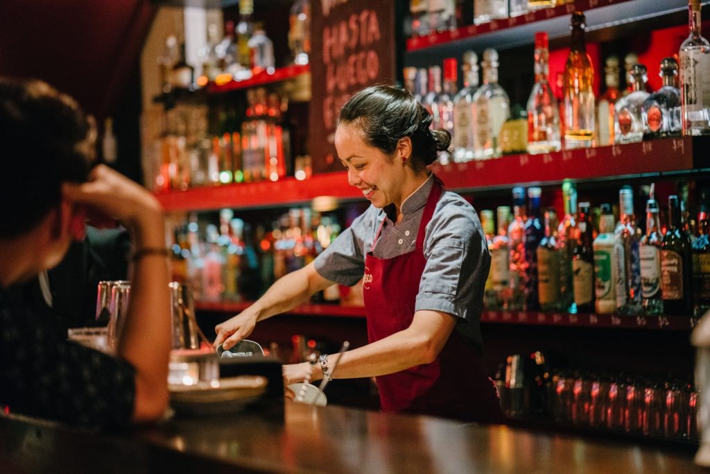Woman bartender teaching mixology classes