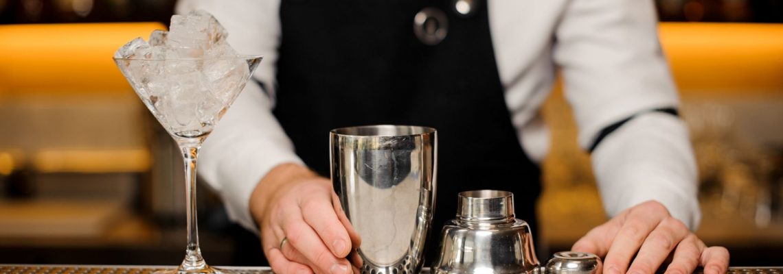 Bartender mixing a cocktail with mixology kit as the perfect gift for bartenders