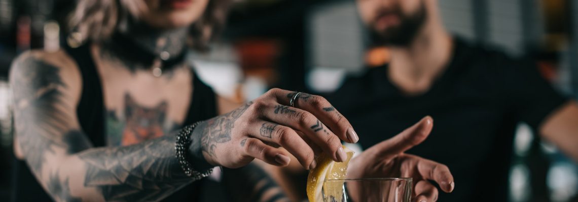 Beginner bartender practising techniques and mixology terms