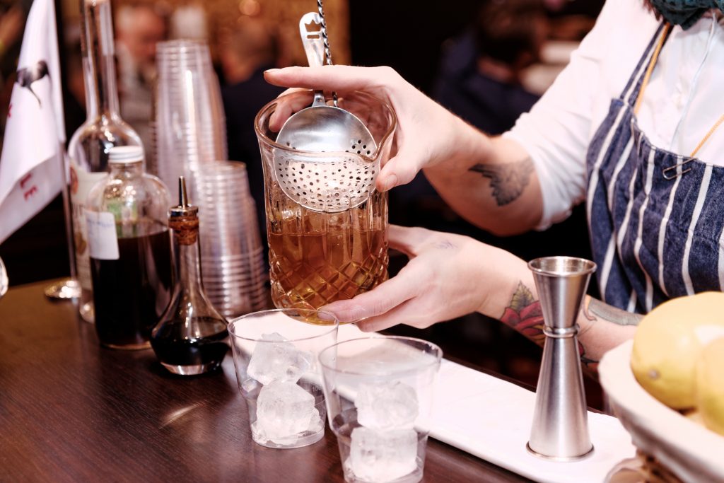 Bartender using a Julep strainer