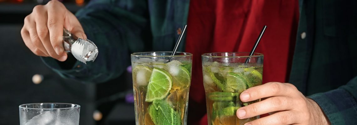 Bartender preparing mint julep cocktail with mixology basics
