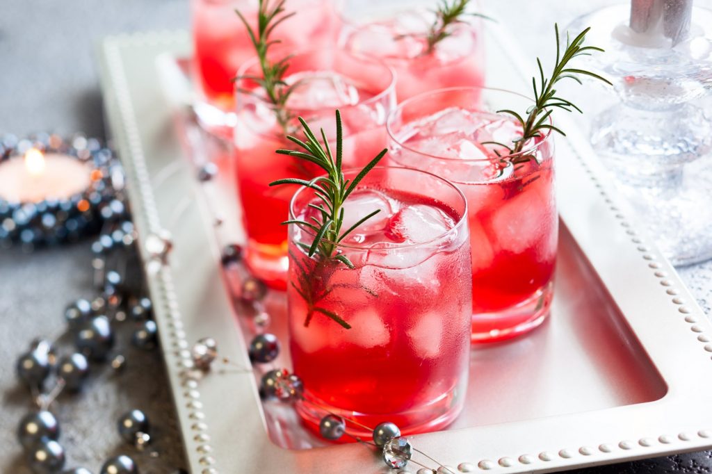 Festive holiday cocktails on a serving tray