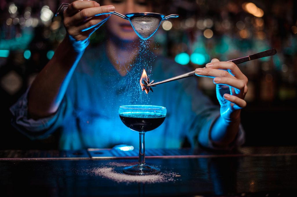 Female Bartender Making a Fun Experimental Cocktail